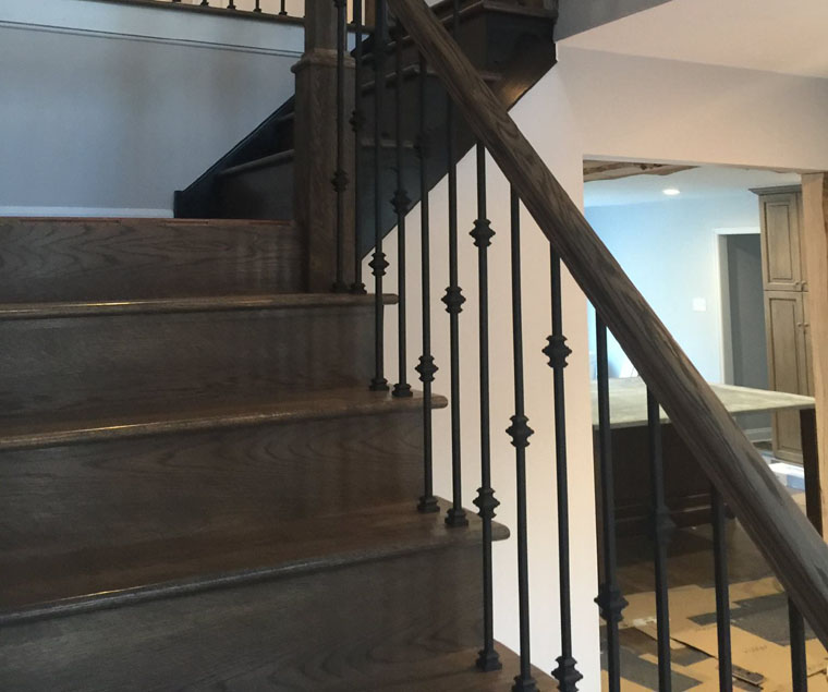 New stairwell with wrought iron spindles