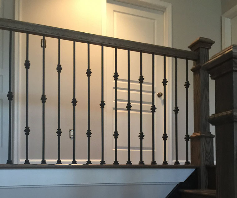 New stairwell with wrought iron spindles